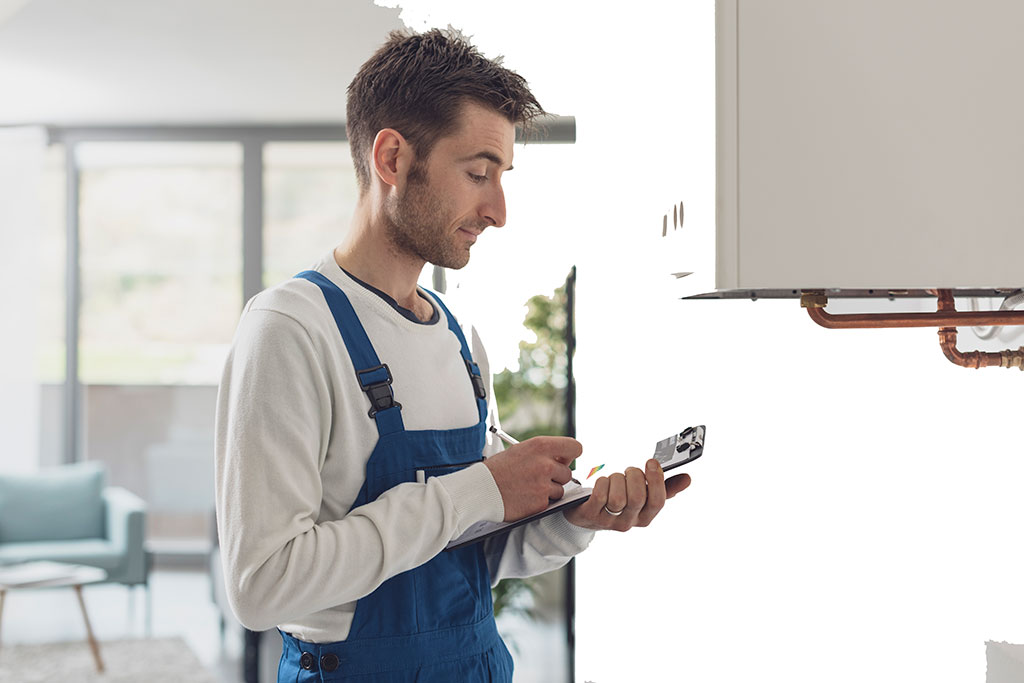 gas fast engineer checking boiler